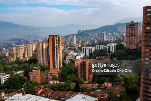 tall buildings on hillside - medellín stockfoto's en -beelden