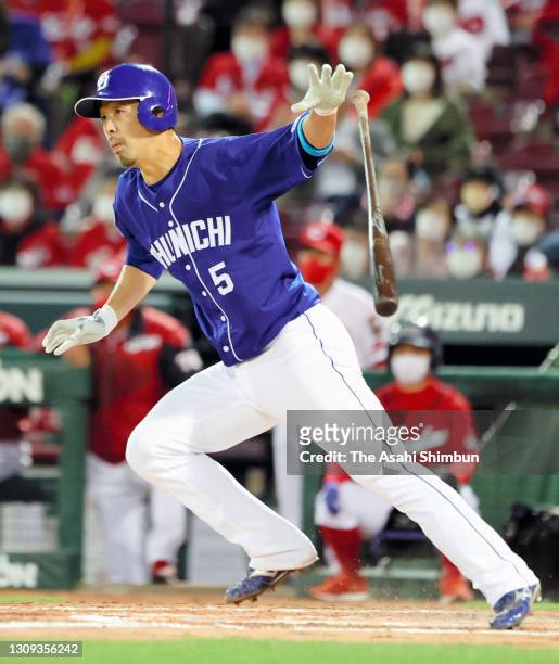 Toshiki Abe of the Chunichi Dragons hits a RBI single in the 8th inning against the Hiroshima Carp at the Mazda Zoom Zoom Stadium Hiroshima on March...