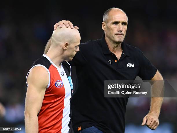 Tony Lockett shakes hands with Zak Jones of the Saints before the start of the round 2 AFL match between the St Kilda Saints and the Melbourne Demons...