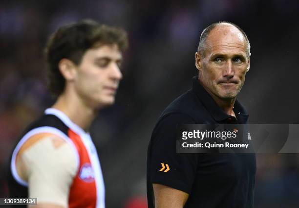 Tony Lockett and Nick Coffield of the Saints look on before the start of the round 2 AFL match between the St Kilda Saints and the Melbourne Demons...