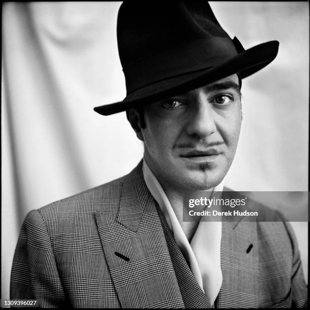 British born fashion designer John Galliano poses for a portrait in his eleventh arrondissement Paris atelier wearing a double breasted Prince of...