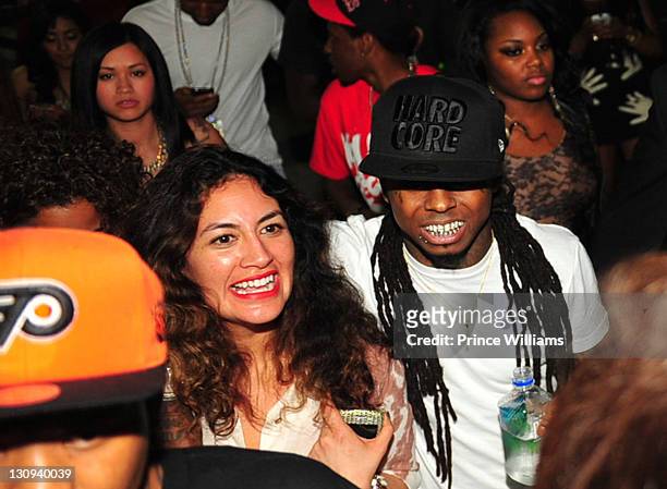 Marissa Torres and Lil Wayne leave the Lil Wayne I Am Music II Tour After-Party at Compound on April 9, 2011 in Atlanta, Georgia.