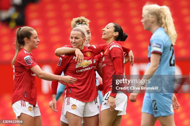 Christen Press of Manchester United celebrates with teammates Ella Toone, Jackie Groenen and Lauren James after scoring her team's second goal during...