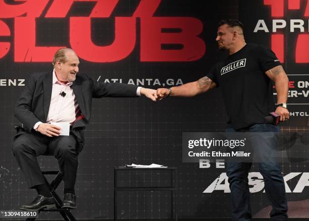 Announcer Al Bernstein fist-bumps Frank Mir as he arrives at a news conference for Triller Fight Club's inaugural 2021 boxing event at The Venetian...