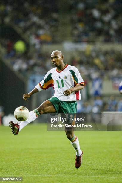 El Hadji Diouf of Senegal in action during the World Cup 1st round match between France and Senegal at the Seoul World Cup Football Stadium on May...