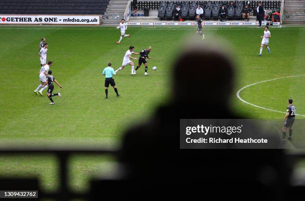 John Bostock of Doncaster on the ball as a scout watches from the stands during the Sky Bet League One match between Milton Keynes Dons and Doncaster...