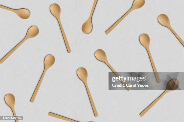 top view wooden spoon pattern in white background - wooden spoon stock pictures, royalty-free photos & images