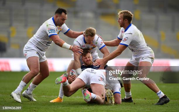 Tom Johnstone of Wakefield is brought to ground during the Betfred Super League match between Wakefield Trinity and Leeds Rhinos at Emerald...