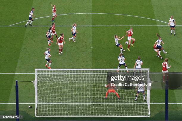 Vivianne Miedema of Arsenal scores their team's second goal past Rebecca Spencer of Tottenham Hotspur during the Barclays FA Women's Super League...