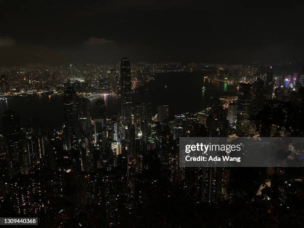 earth hour 2021 hong kong victoria habour - earth hour stock pictures, royalty-free photos & images
