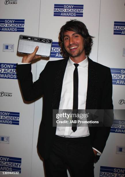 George Lamb poses with his award for Sony DAB Rising Star Award during the show at the Sony Radio Academy Awards held at the Grosvenor House Hotel on...