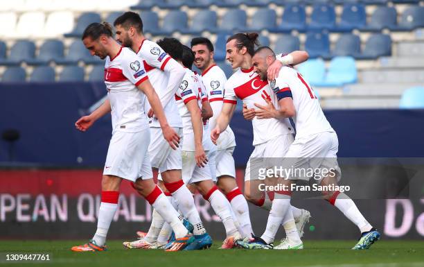 Caglar Soyuncu of Turkey celebrates with teammates after scoring their team's second goal during the FIFA World Cup 2022 Qatar qualifying match...