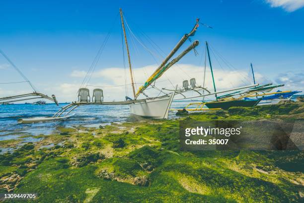 fishermens boat, the philippines - boracay beach stock pictures, royalty-free photos & images