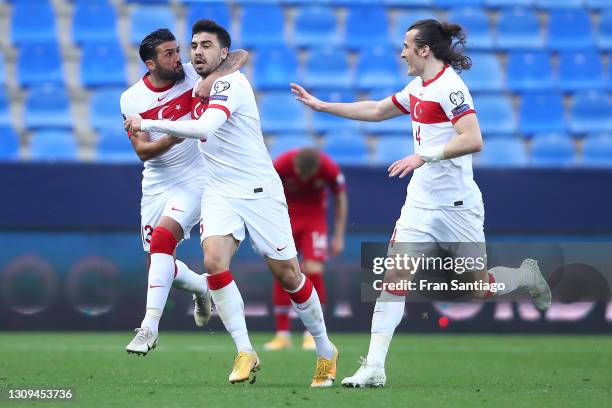 Ozan Tufan of Turkey celebrates with Umut Merao and Caglar Soyuncu after scoring their team's third goal during the FIFA World Cup 2022 Qatar...