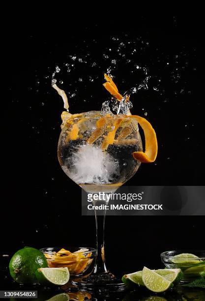 gin tonic glass on a black background - vodka stock pictures, royalty-free photos & images