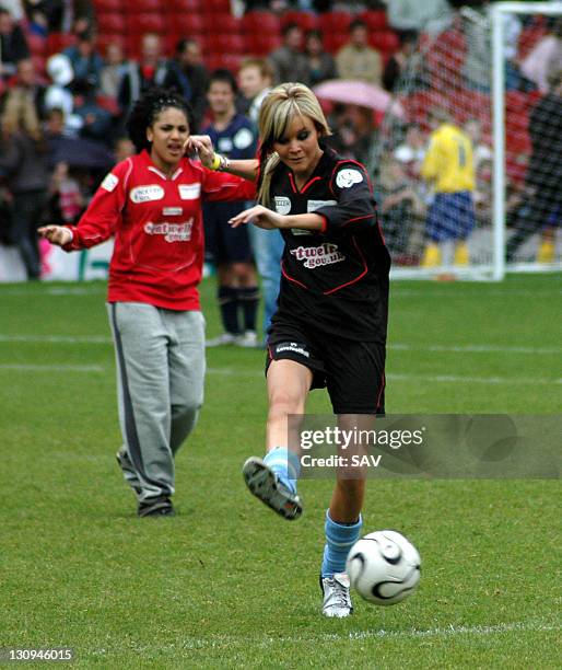 Aimee from Clea shoots for goal during Celebrity World Cup Soccer Six Match at West Ham United Football Club in London, Great Britain.