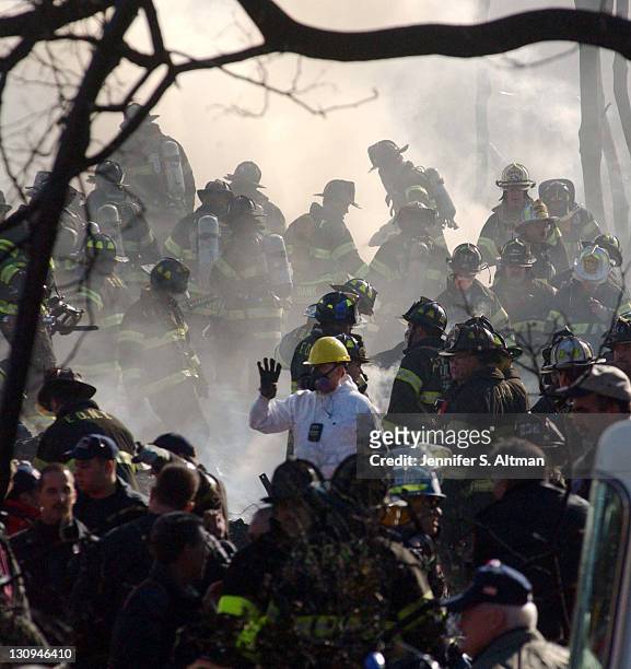 Rescue workers on the scene of the crash of American Airlines Flight 587 in Rockaway Beach, Queens, New York. More than 260 people died in the crash...