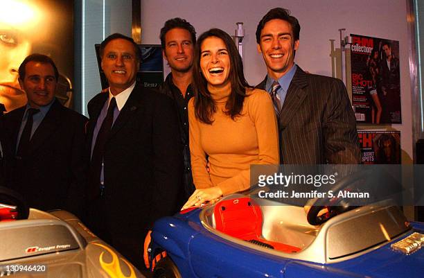 S Paul Iannizzotto, Mercedes-Benz's Dave Schemberry, John Corbett, Angie Harmon and Jason Sehorn stand with mini-Mercedes-Benz cars during the...