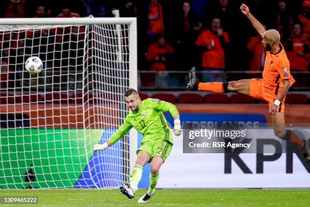 Goalkeeper Roberts Ozols of Latvia and Ryan Babel of the Netherlands during the FIFA World Cup 2022 Qatar Qualifier match between Netherlands and...