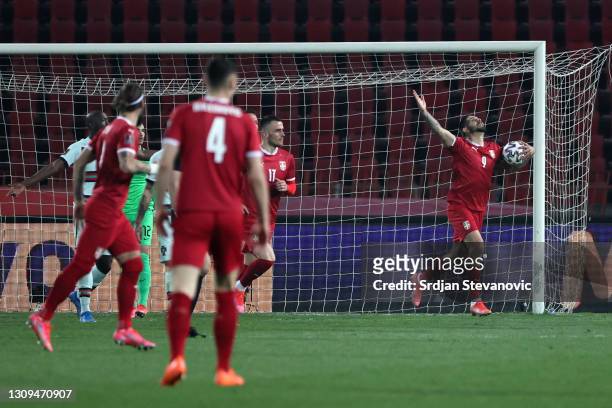 Aleksandar Mitrovic of Serbia celebrates after scoring their team's first goal during the FIFA World Cup 2022 Qatar qualifying match between Serbia...
