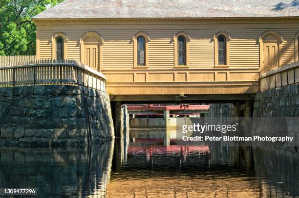 waterway and canal locks that provided power and transportation for the textile mills at the lowell national historical park - lowell massachusetts stock pictures, royalty-free photos & images