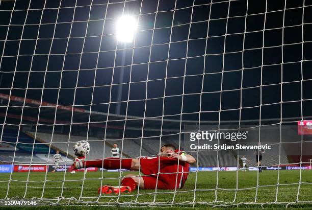 Stefan Mitrovic of Serbia clears the ball off the line during the FIFA World Cup 2022 Qatar qualifying match between Serbia and Portugal at FK Crvena...