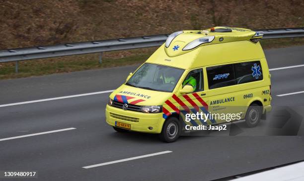 dutch ambulance driving on dutch highway a-28 at zeist - ambulance approaching stock pictures, royalty-free photos & images