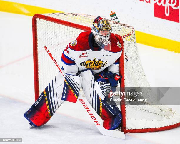 Sebastian Cossa of the Edmonton Oil Kings in action against the Calgary Hitmen during a WHL game at Seven Chiefs Sportsplex on March 27, 2021 in...