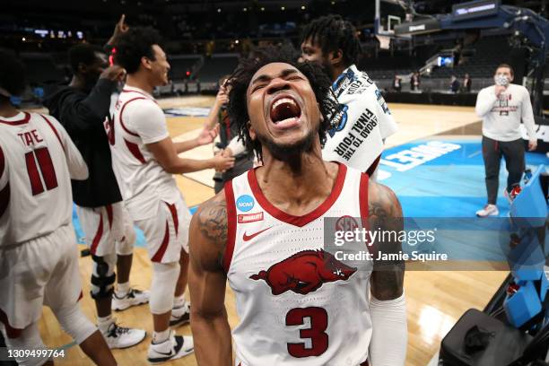 Desi Sills of the Arkansas Razorbacks celebrates after defeating the Oral Roberts Golden Eagles in the Sweet Sixteen round of the 2021 NCAA Men's...