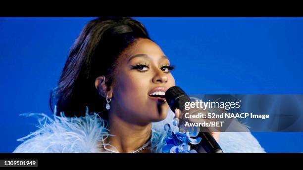 In this screengrab, Jazmine Sullivan performs onstage during the 52nd NAACP Image Awards on March 27, 2021.