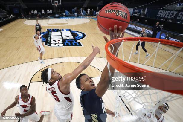 Jamie Bergens of the Oral Roberts Golden Eagles attempts the layup against the Arkansas Razorbacks during the second half in the Sweet Sixteen round...