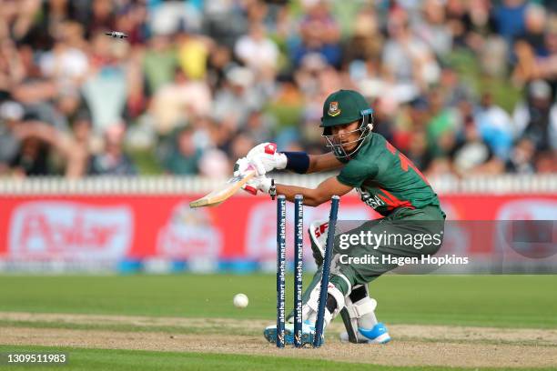 Afif Hossain of Bangladesh is bowled by Lockie Ferguson of New Zealand during game one of the International T20 series between New Zealand and...