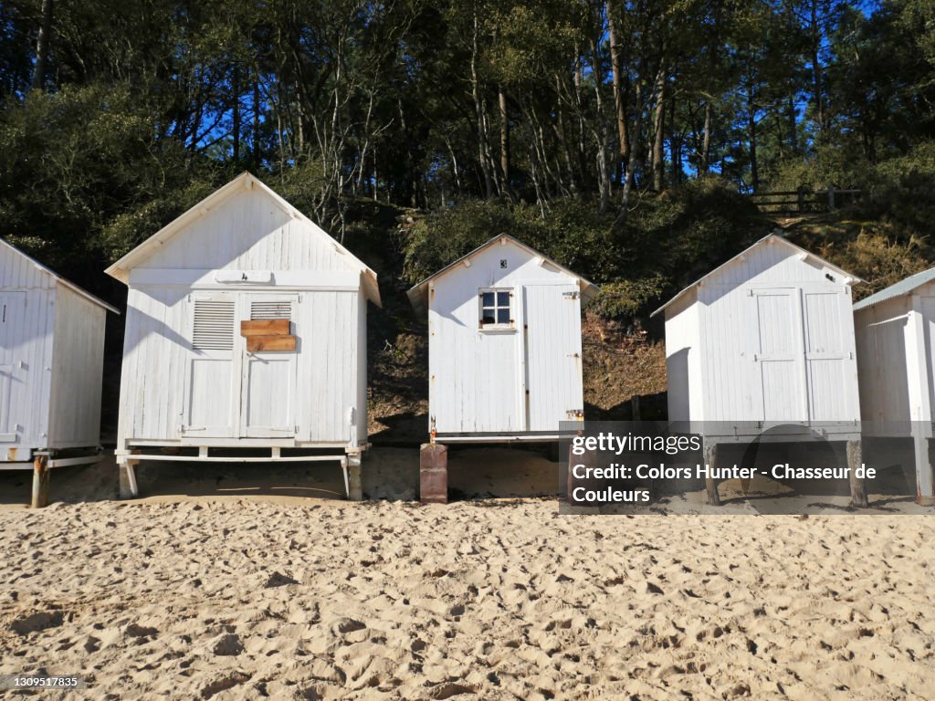 White and retro cabins on a beach in Noirmoutier in France