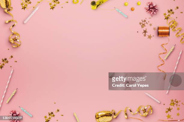 top view party frame background in pink surface - streamer stock-fotos und bilder