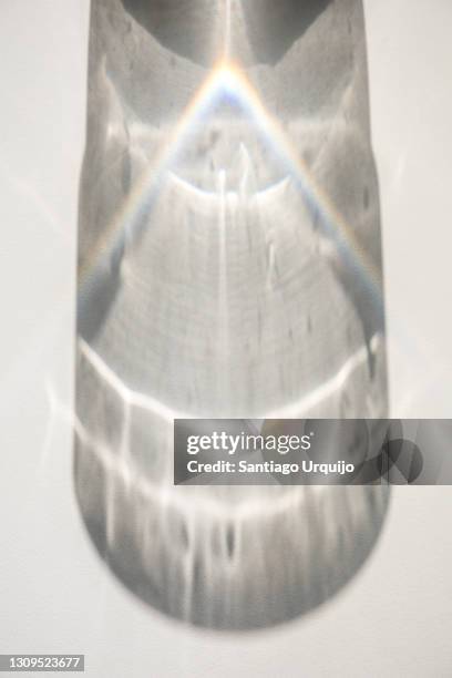 shadow and refraction on sunlight through a water glass - glass shadow stockfoto's en -beelden