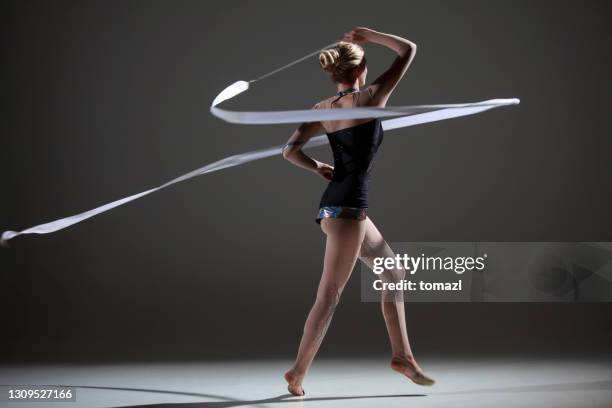 rhytmic gymnastics with ribbon - rhythmic gymnastics stock pictures, royalty-free photos & images