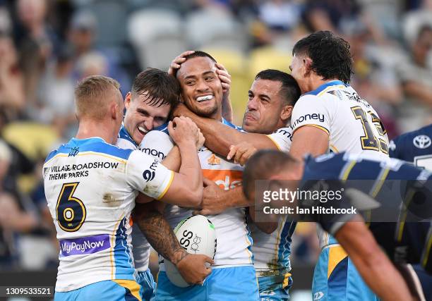 Phillip Sami of the Titans celebrates after scoring a try during the round three NRL match between the North Queensland Cowboys and the Gold Coast...