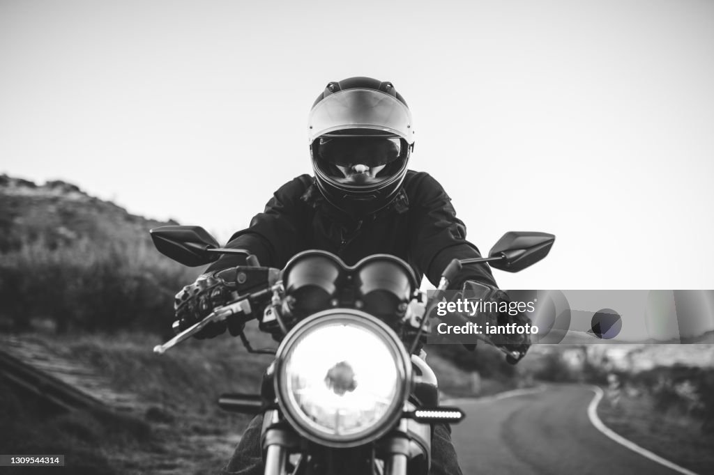 Riding the classic motorcycle through the countryside.