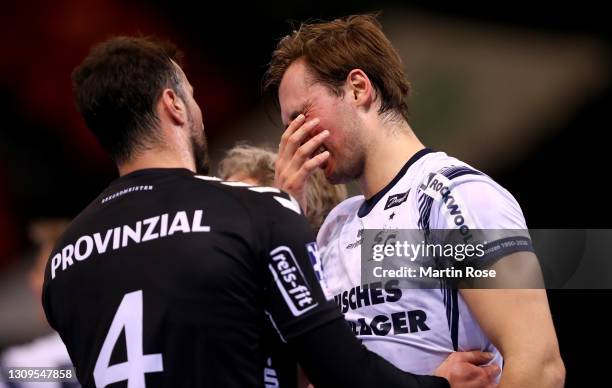 Magnus Rod of SG Flensburg-Handewitt discus with Domagoj Duvnjak of THW Kiel during the Liqui Moly Handball Bundesliga match between SG...