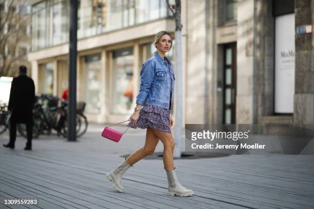 Scarlett Gartmann wearing beige Copenhagen Studios boots, Neo Noir flower mini dress, pink Chanel Wallet on Chain bag and blue Levis jeans jacket on...
