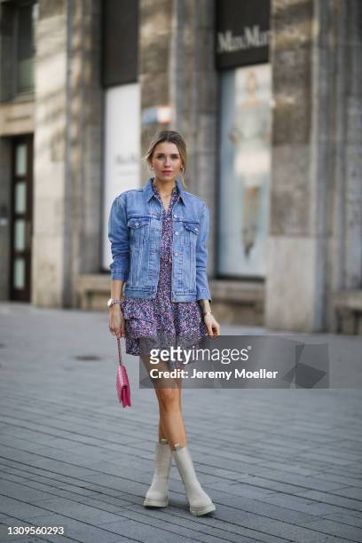 Scarlett Gartmann wearing beige Copenhagen Studios boots, Neo Noir flower mini dress, pink Chanel Wallet on Chain bag and blue Levis jeans jacket on...
