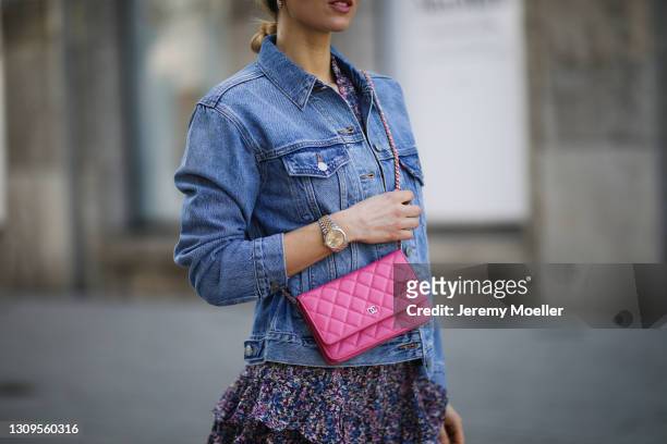 Scarlett Gartmann wearing Neo Noir flower mini dress, pink Chanel Wallet on Chain bag and blue Levis jeans jacket on March 24, 2021 in Dusseldorf,...