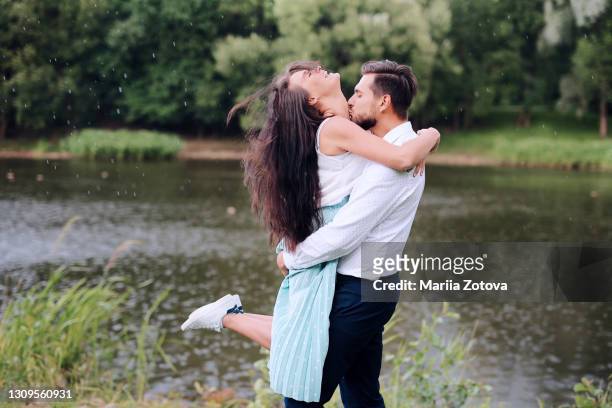 young couple of lovers having fun together in the park - ideal wife stock pictures, royalty-free photos & images