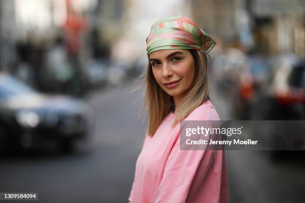 Diana Kaloev wearing Edited headband and pink shirt dress on March 26, 2021 in Cologne, Germany.