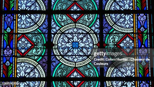 colorful and bright stained glass window of a chapel in paris - religious illustration stock pictures, royalty-free photos & images