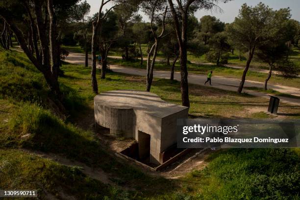 Man run past a machine gun pillbox that was used by Republicans to defend Madrid from Franco's forces during the Spanish Civil War following the...