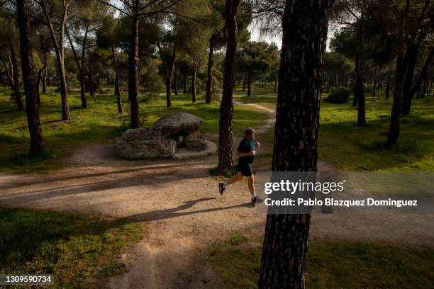 Man run past a machine gun pillbox that was used by Republicans to defend Madrid from Franco's forces during the Spanish Civil War following the...