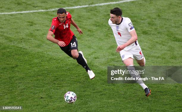Declan Rice of England battles for possession with Andrei Cojocari of Moldova during the FIFA World Cup 2022 Qatar qualifying match between Albania...