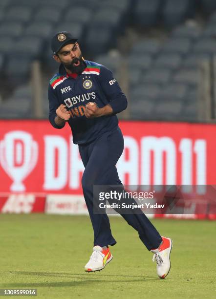Virat Kohli of India celebrates following the 3rd One Day International match between India and England at MCA Stadium on March 28, 2021 in Pune,...