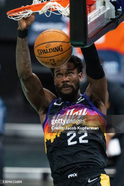 Deandre Ayton of the Phoenix Suns dunks the ball against the Charlotte Hornets during the third quarter during their game at Spectrum Center on March...